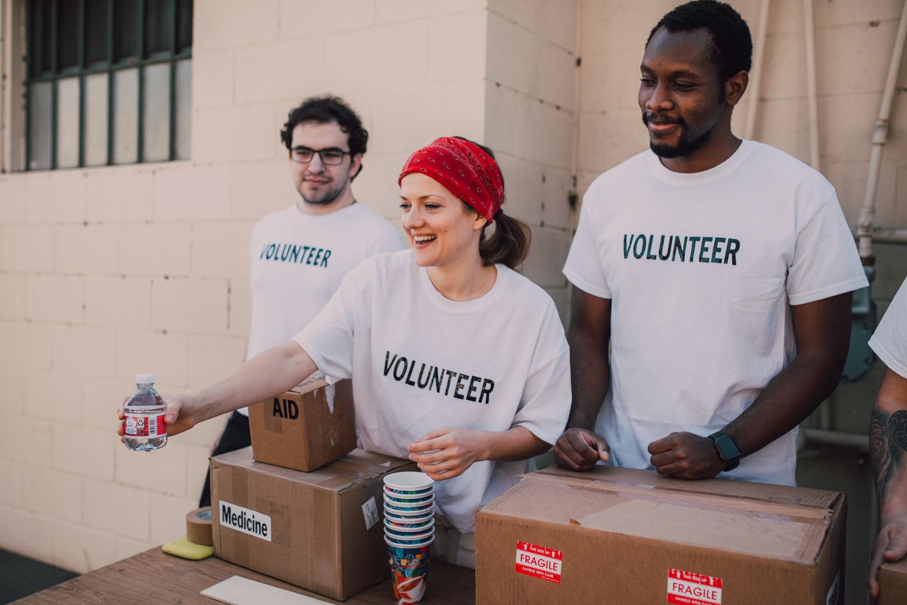 Volunteers working together to prepare community donations
